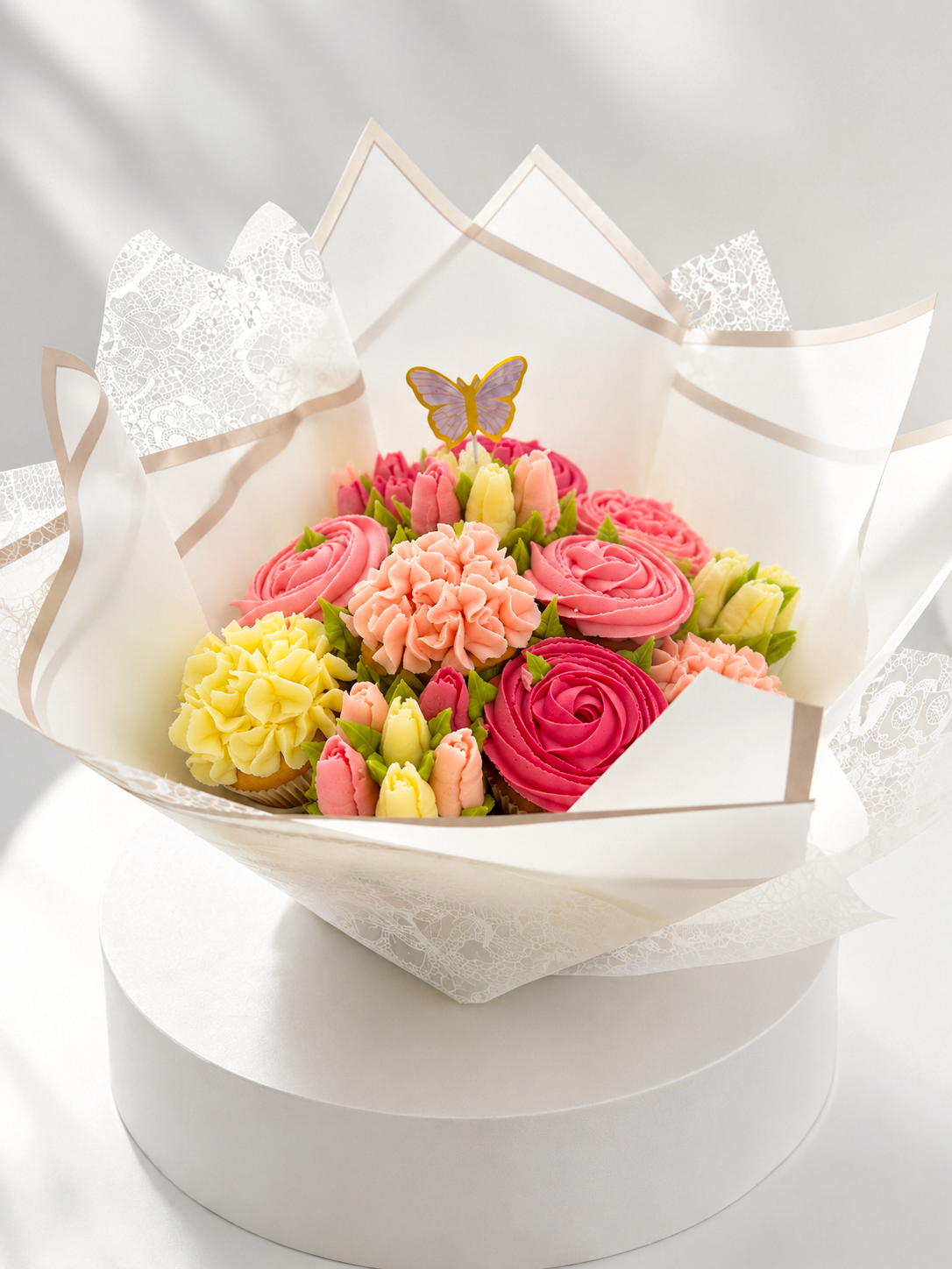 Blush Meadow cupcake bouquet styled on display stand