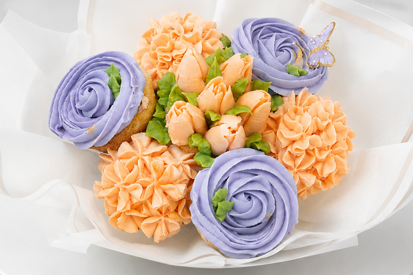 Close-up of Violet and Cream cupcake bouquet, handmade cupcakes UAE