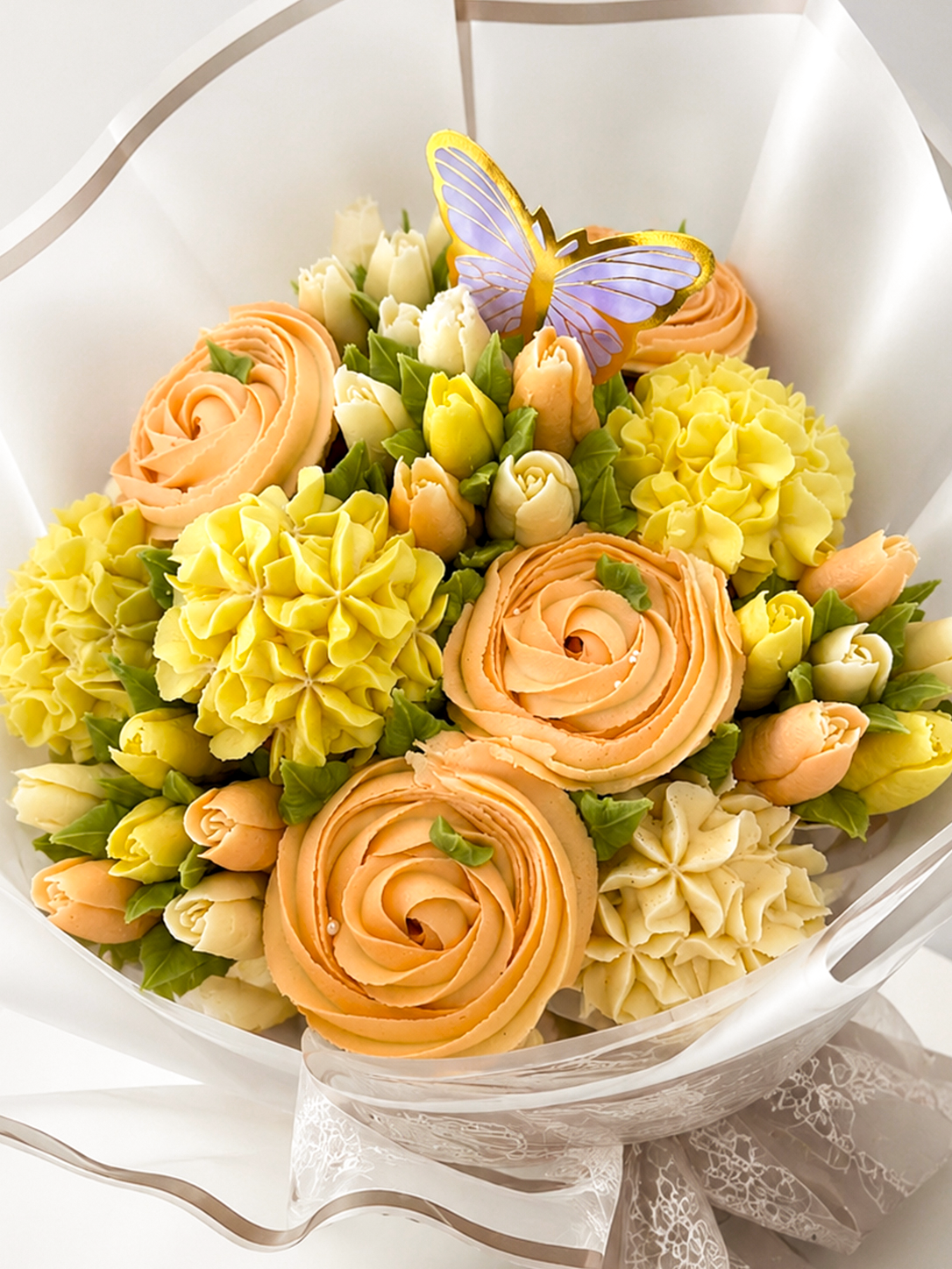 Sunlit Bloom peach and yellow cupcake bouquet, close-up view