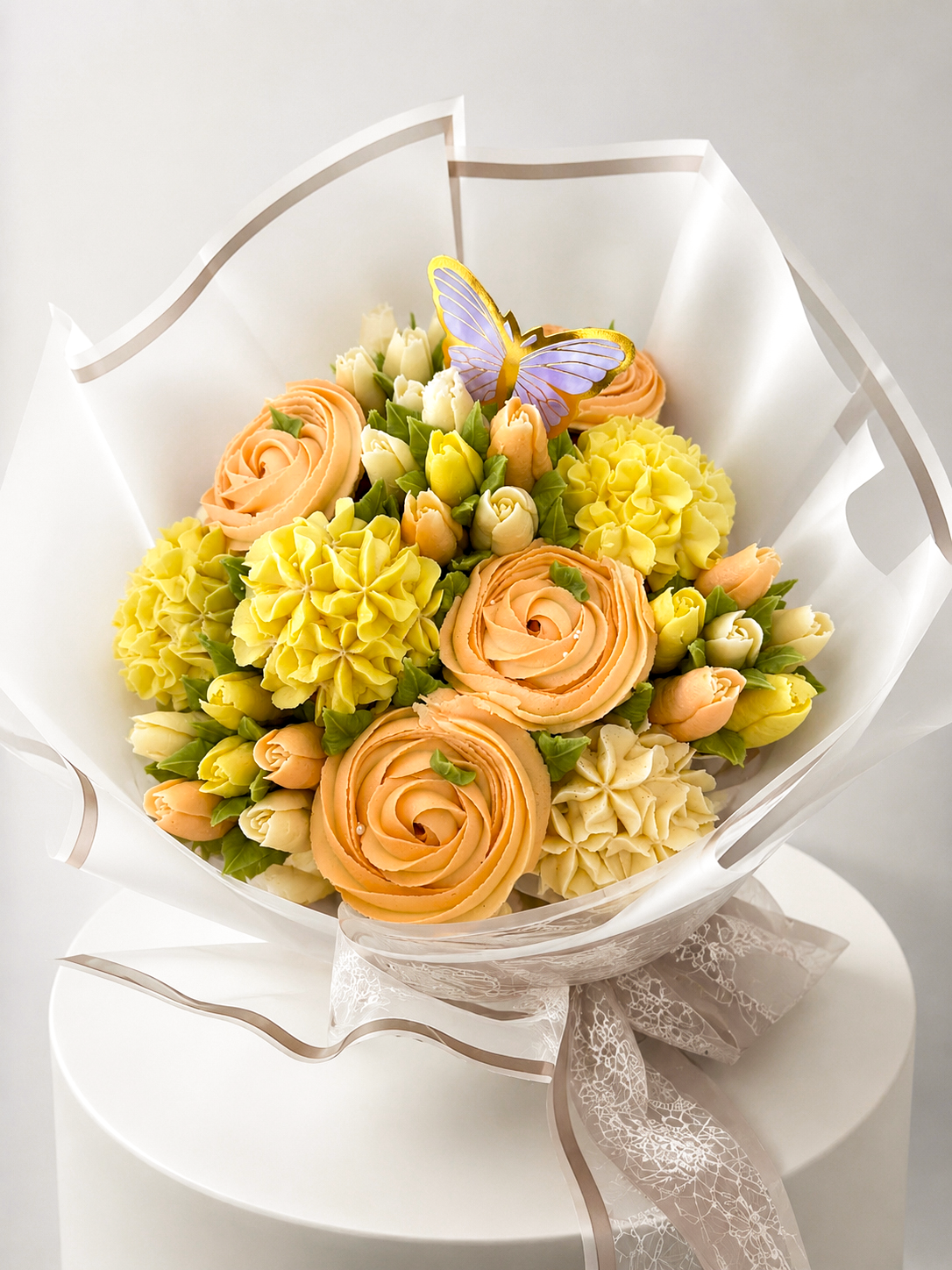 Sunlit Bloom cupcake bouquet styled on display stand